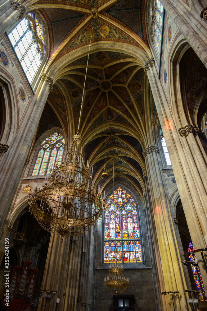 VIENNA, AUSTRIA - AUGUST 11, 2017: Interior of the Votive Church in Vienna. The church was consecrated in 1879 and is in Gothic revival style
