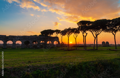 Photography Rome (Italy) - The Parco degli Acquedotti at sunset, an archeological public park in Rome, part of the Appian Way Regional Park, with monumental ruins of roman aqueducts