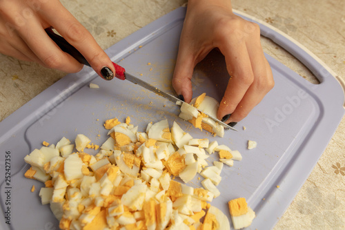 Cutting boiled eggs in the kitchen