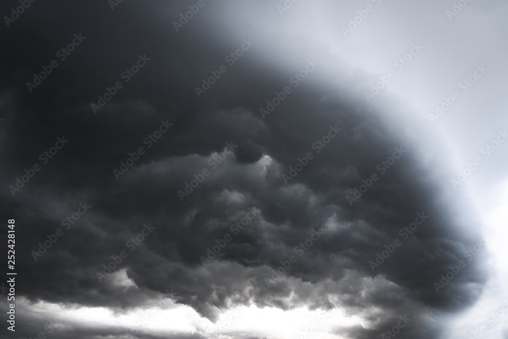 Scary epic sky with menacing clouds. Hurricane wind with a thunderstorm. Stock background, photo Scary epic sky with menacing clouds. Hurricane wind with a thunderstorm. Stock background, photo