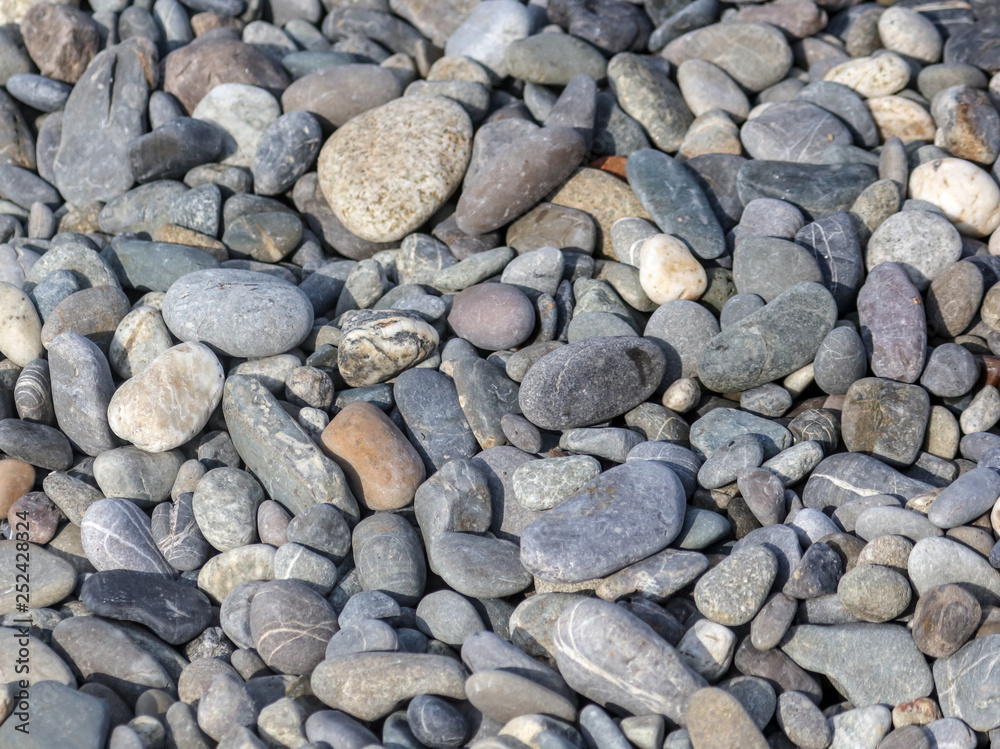 Stone pebbles on the seashore as an abstract background Stone pebbles on the seashore as an abstract background