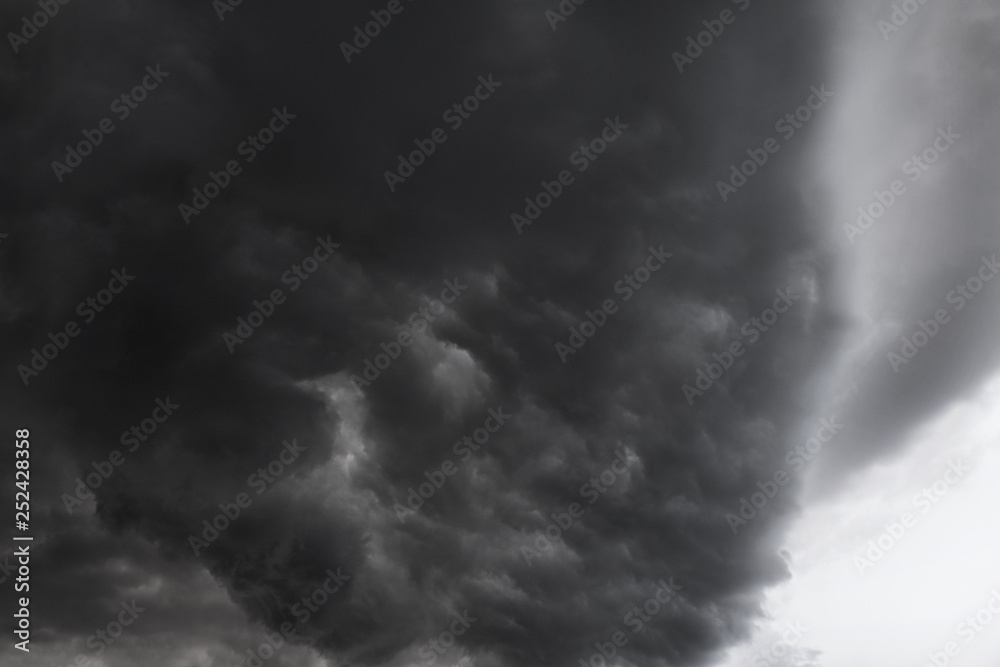 Scary epic sky with menacing clouds. Hurricane wind with a thunderstorm. Stock background, photo
