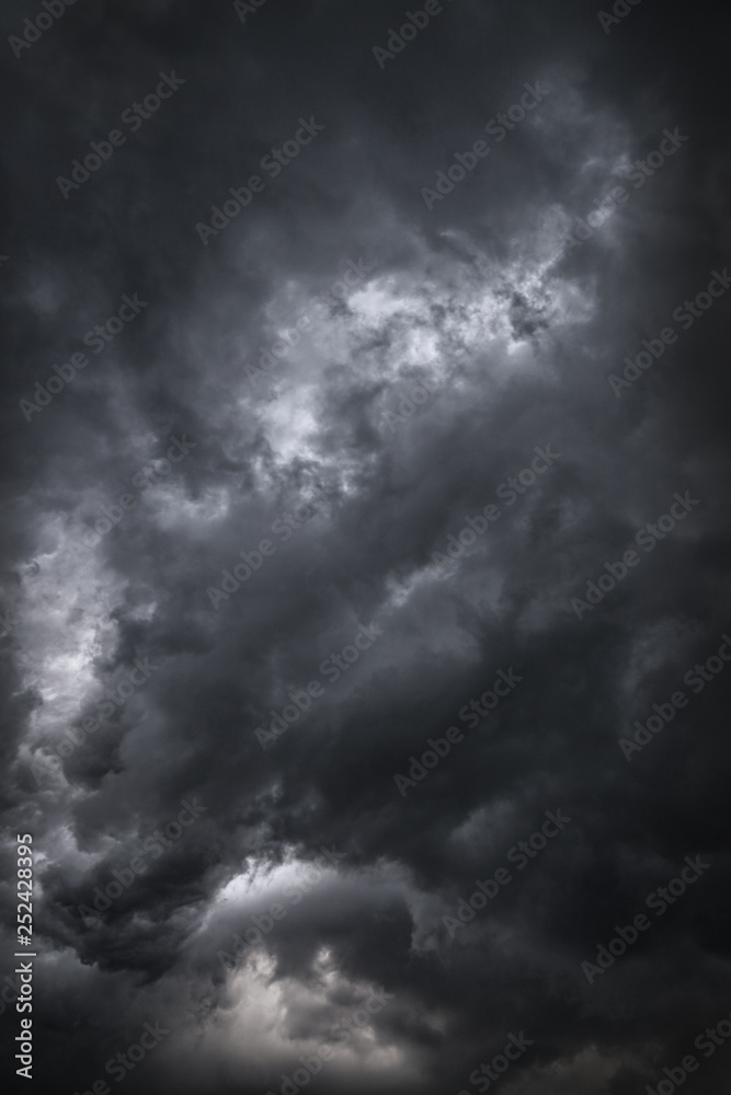 Scary epic sky with menacing clouds. Hurricane wind with a thunderstorm. Stock background, photo