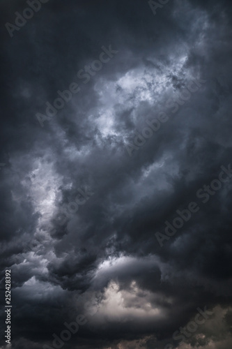 Scary epic sky with menacing clouds. Hurricane wind with a thunderstorm. Stock background  photo