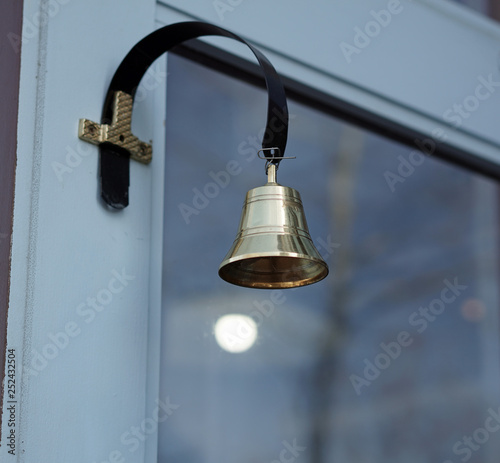 Retail door with bell