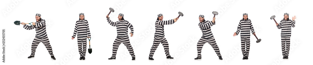 Prison inmate with spade isolated on white Prison inmate with spade isolated on white