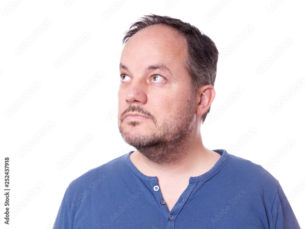 middle aged man thinking and looking up to copy space middle aged man thinking and looking up to copy space