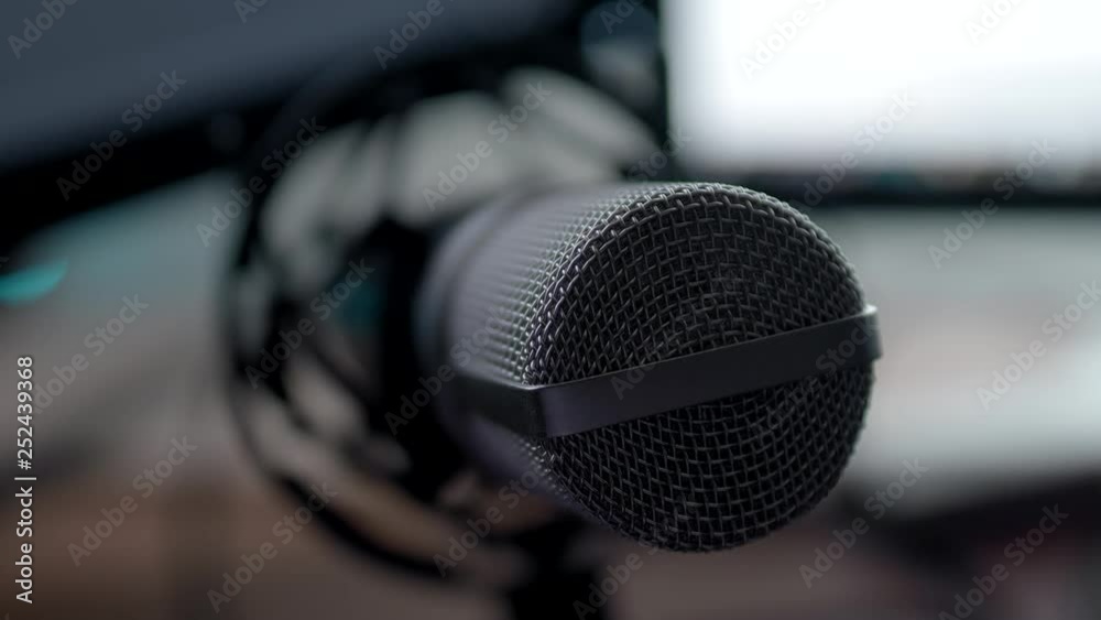 The camera is approaching the microphone in the studio environment; close up macro shot; shallow depth of field The camera is approaching the microphone in the studio environment; close up macro shot; shallow depth of field