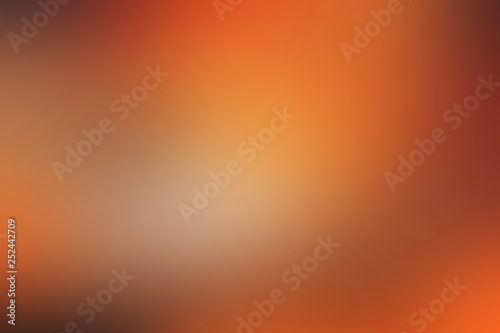 Сolorful smooth blurred background in soft orange colours