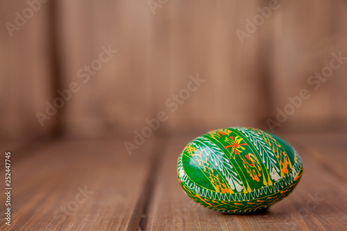 Easter egg on wooden background with copy space