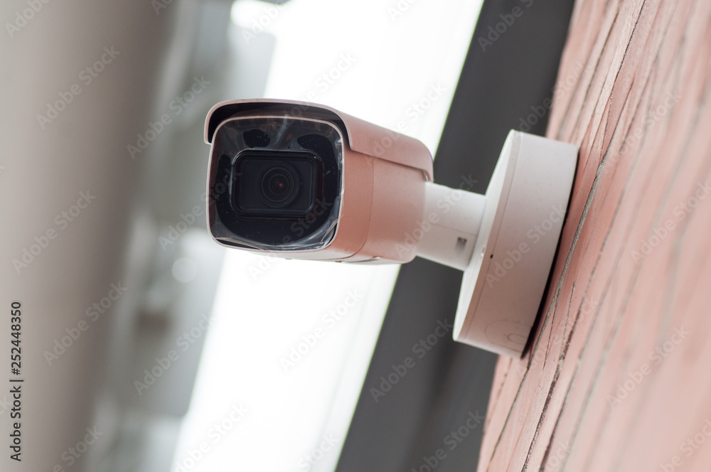 closeup of security camera on modern building