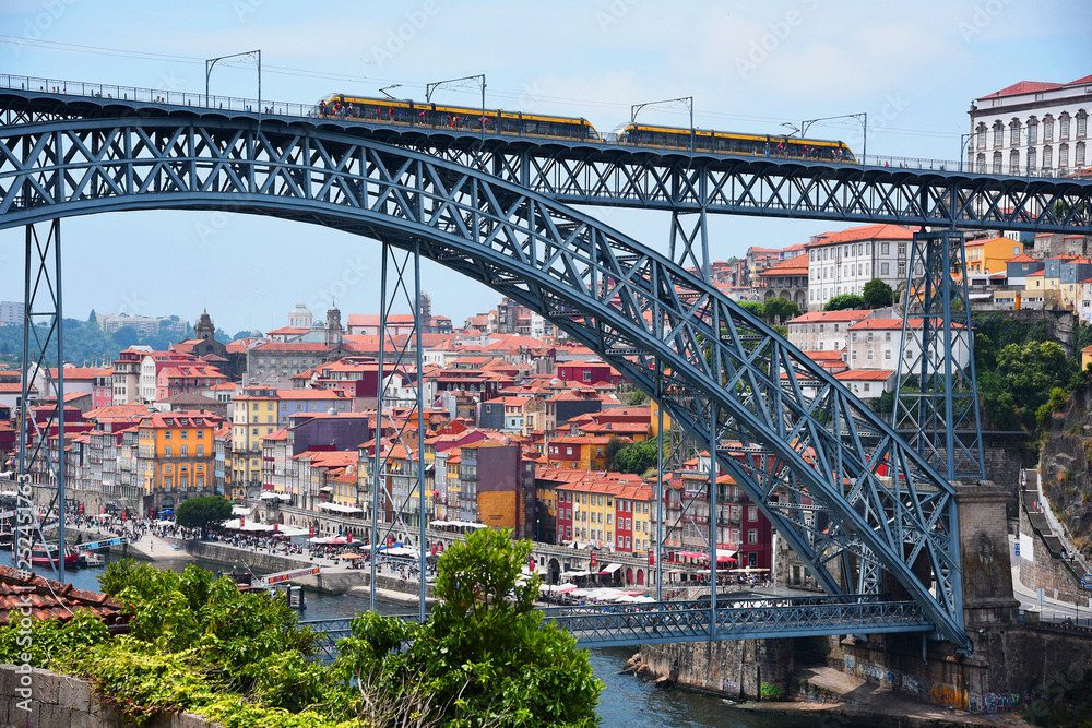 Fototapeta premium Porto, Portugal, Europe. Old Town, view of the Don Luis Bridge on the Douro River, a tourist spot.
