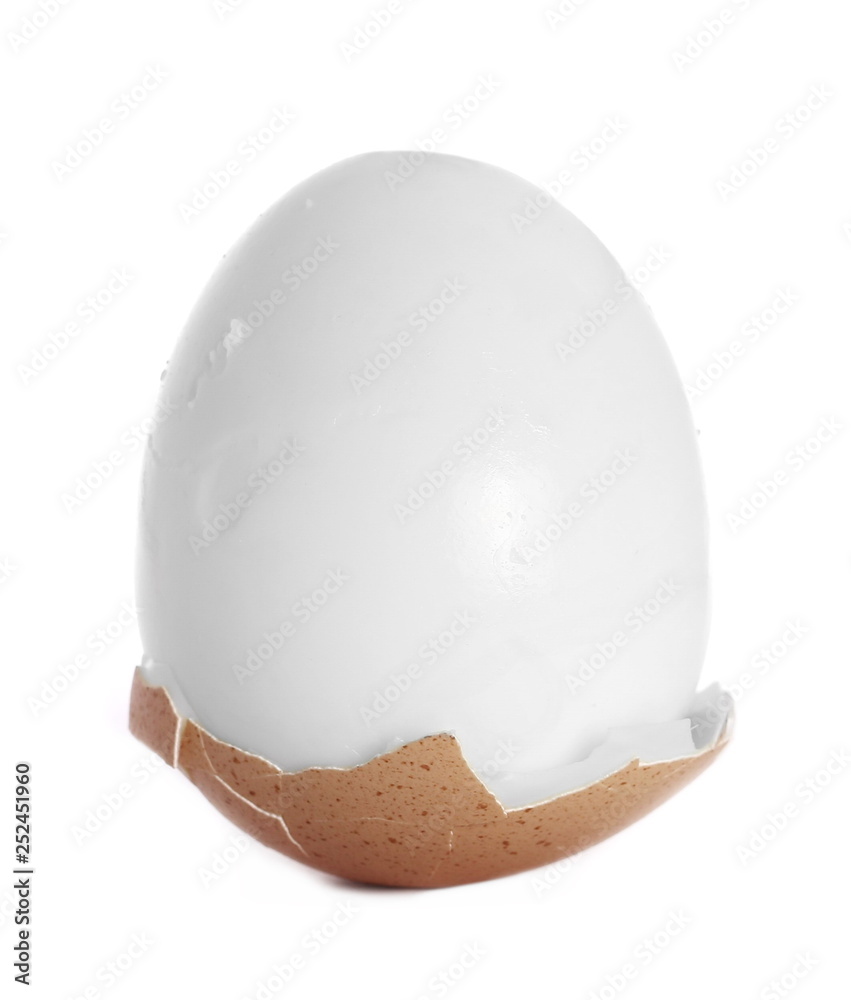 Fototapeta premium Boiled egg with broken shells isolated on white background
