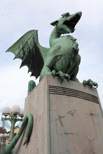 Canvas Print A statue of a dragon on the Dragon Bridge in the capital of Slovenia, Ljubljana,