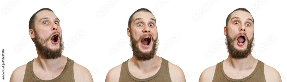 Bald unshaven guy with a beard depicts different emotions: happiness, joy, surprise on an isolated white background Bald unshaven guy with a beard depicts different emotions: happiness, joy, surprise on an isolated white background