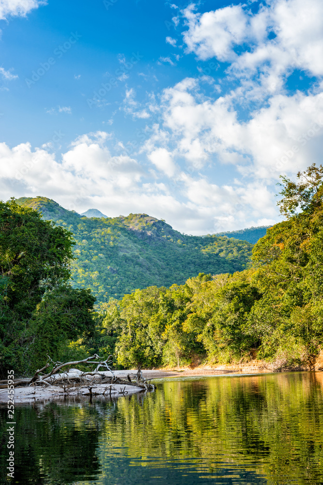 Beautiful sunny day in the Amazonia Basin river. Corocoro river goes along Yutaje Community whicth mean in the native language: River Foam (Espuma del Rio) Beautiful sunny day in the Amazonia Basin river. Corocoro river goes along Yutaje Community whicth mean in the native language: River Foam (Espuma del Rio)