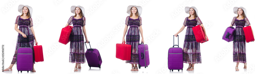 Young woman with suitcases isolated on white