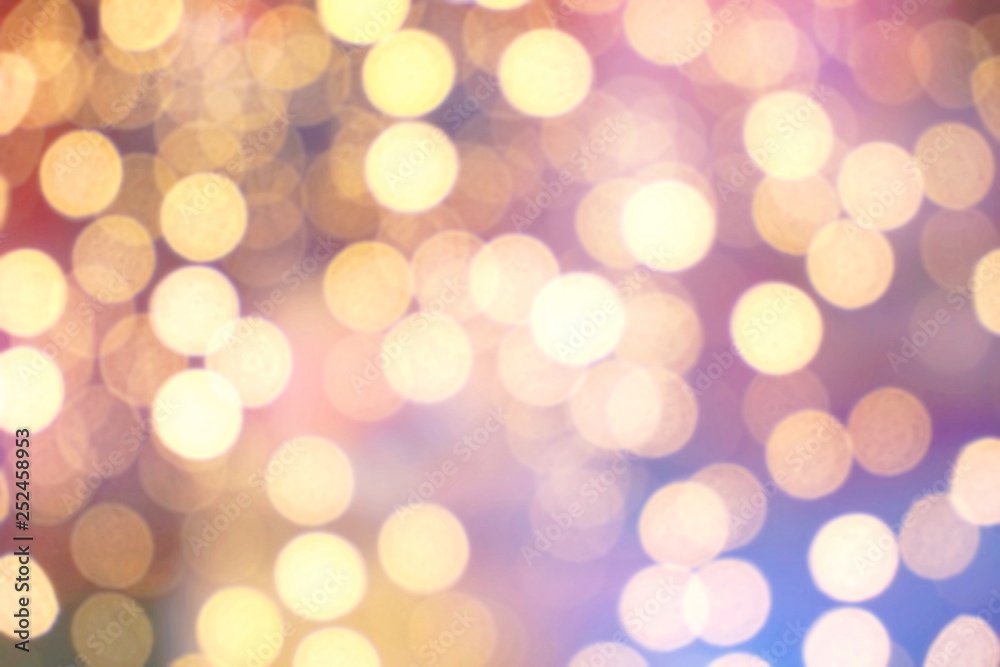 Abstract circular golden light bokeh background.