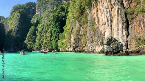 Beautiful tropical Islands and lagoons Thailand travel on a traditional long-tail boat