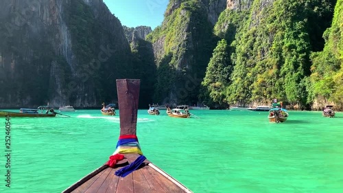 Beautiful tropical Islands and lagoons Thailand travel on a traditional long-tail boat