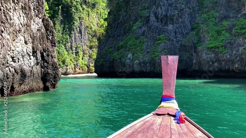 Beautiful tropical Islands and lagoons Thailand travel on a traditional long-tail boat