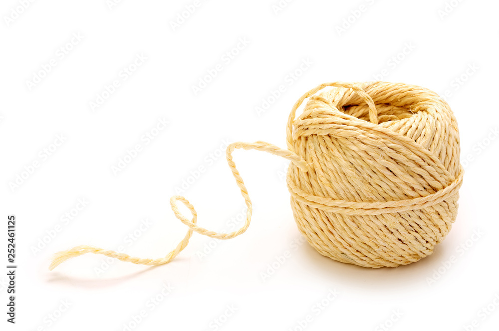 Natural brown coiled ball of coarse, jute, twine or string isolated on white background. Natural brown coiled ball of coarse, jute, twine or string isolated on white background.