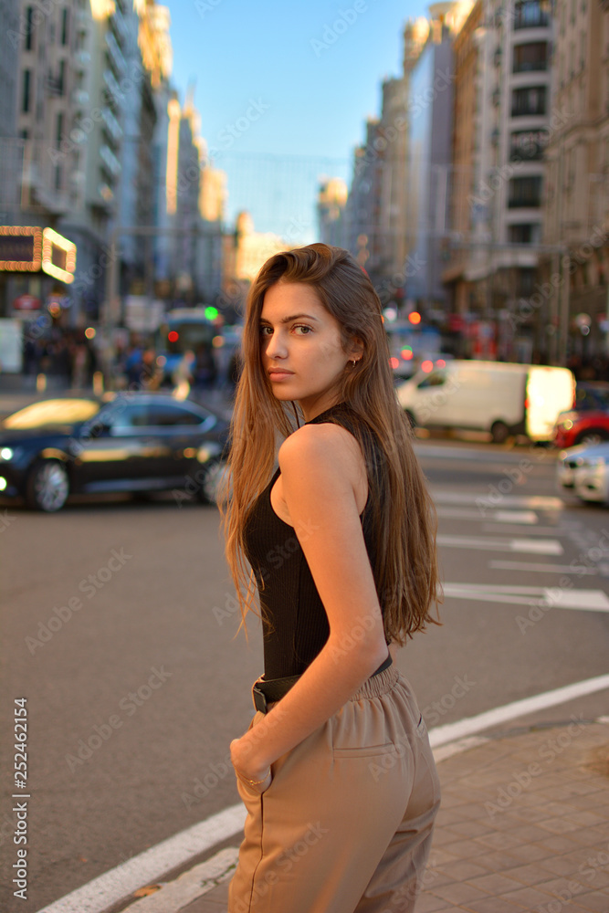 Fototapeta premium Woman enjoy the walk on Madrid Gran Via street and doing shopping