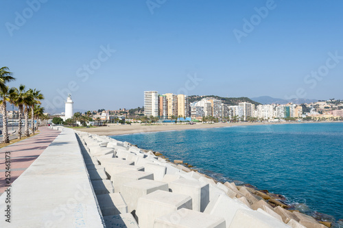 Dock of the port of Malaga with the beach in the background © Alvaro