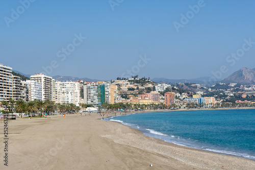 Malaga beach seen from the harbor on a sunny day
