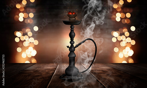 Hookah in a dark room with ...