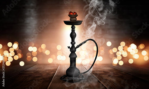 Hookah in a dark room with ...