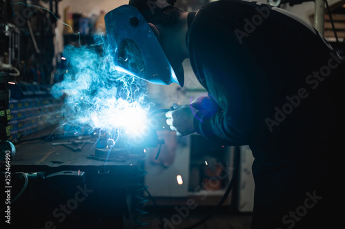 Bicycle mechanic in a workshop in the repair process.