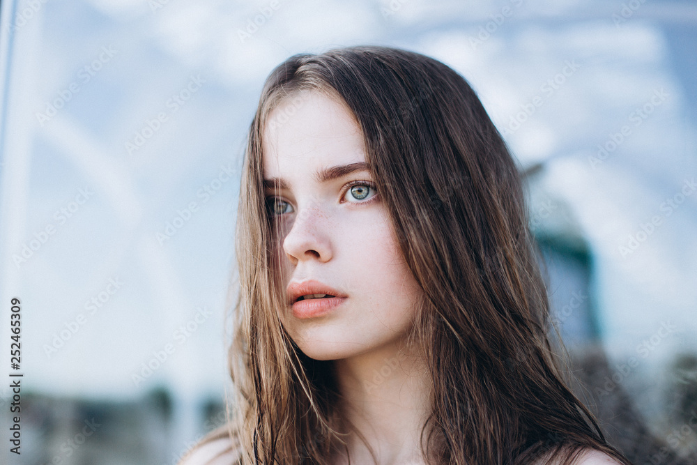 Portrait of caucasian sensual emotional teen depressed girl outdoors. Adolescence, urban, beauty concept