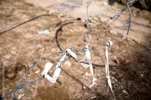 Barbed wire on a brown background