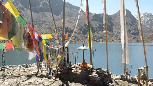 Langtang National Park in the Himalayas, Nepal. 4300m altitude, Beautiful view to Langtang range. Prayer flags are waving with strong wind on the foreground. photo