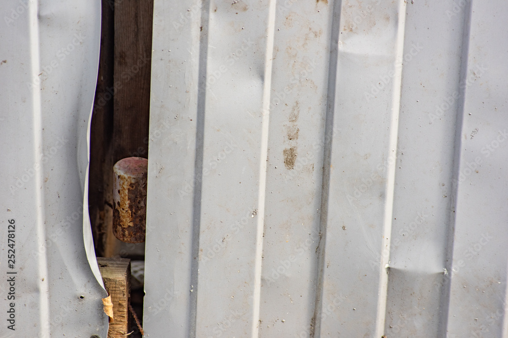 Crumpled corrugated fence Crumpled corrugated fence