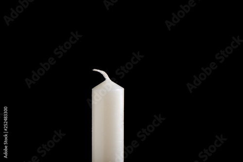 White unlit candle isolated on white background photo