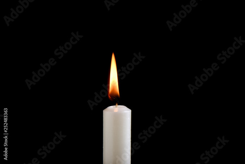 White burning candle isolated on white background