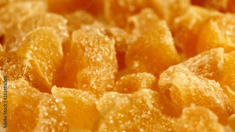Close up heap of crystallized candied ginger pieces rotating. Yummy snack, better alternative to candy Close up heap of crystallized candied ginger pieces rotating. Yummy snack, better alternative to candy