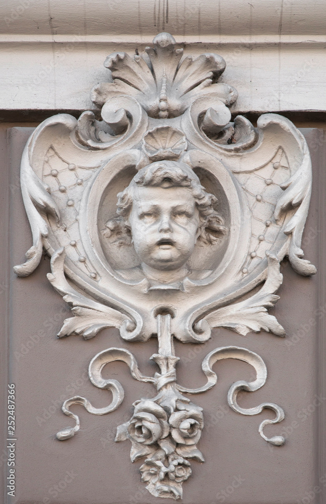 The face of the angel of the Cherubim is part of the ornamental design of the pedestal. Sculpture in construction.