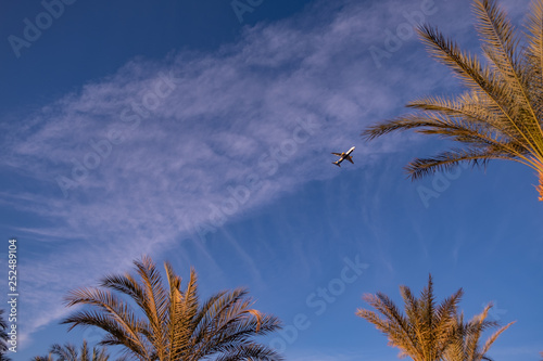 plane flying across the blue sky. advertising space