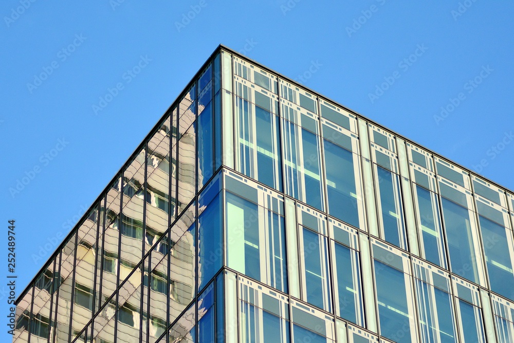 The windows of a modern building for offices. Business buildings architecture.