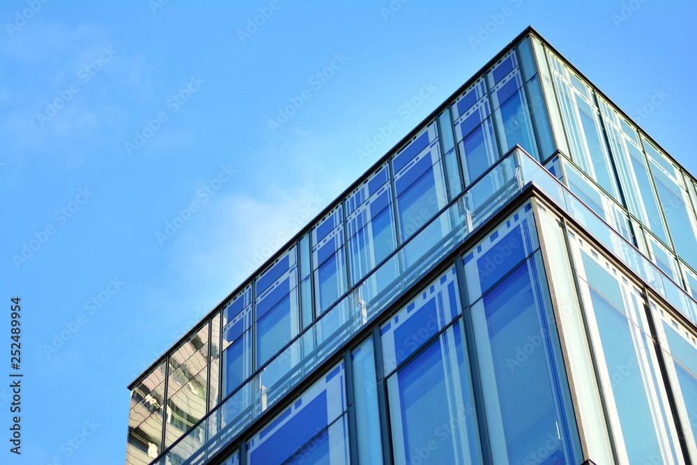 The windows of a modern building for offices. Business buildings architecture. The windows of a modern building for offices. Business buildings architecture.