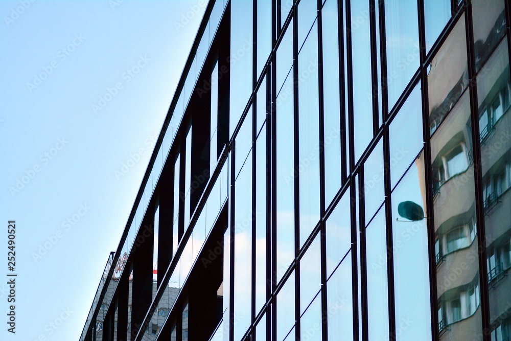 The windows of a modern building for offices. Business buildings architecture. The windows of a modern building for offices. Business buildings architecture.