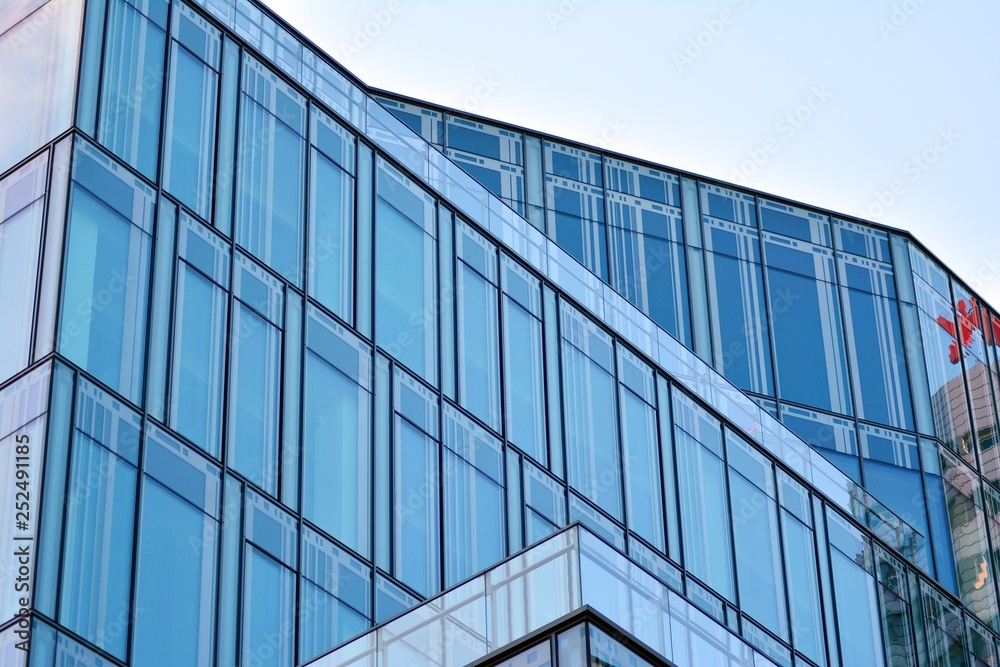 The windows of a modern building for offices. Business buildings architecture. The windows of a modern building for offices. Business buildings architecture.