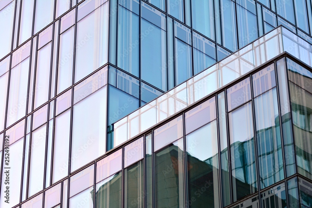The windows of a modern building for offices. Business buildings architecture. The windows of a modern building for offices. Business buildings architecture.