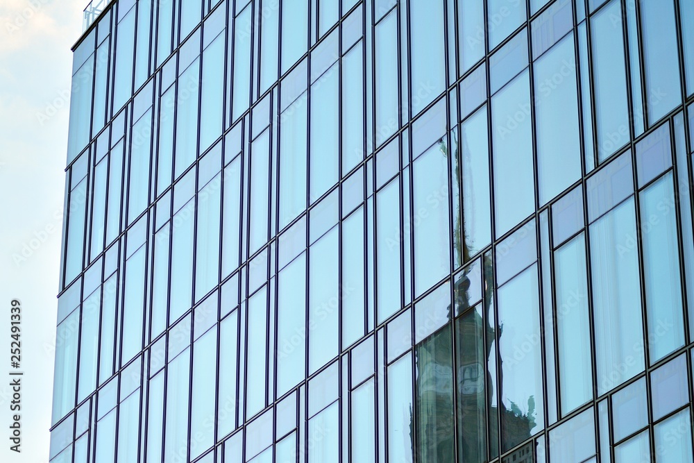 The windows of a modern building for offices. Business buildings architecture. The windows of a modern building for offices. Business buildings architecture.