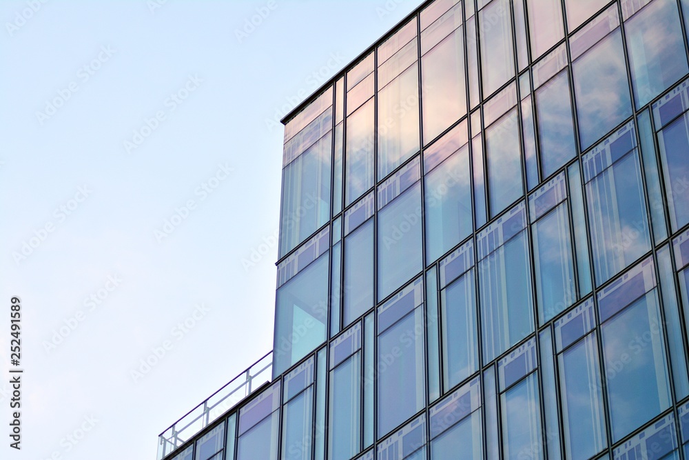 The windows of a modern building for offices. Business buildings architecture. The windows of a modern building for offices. Business buildings architecture.