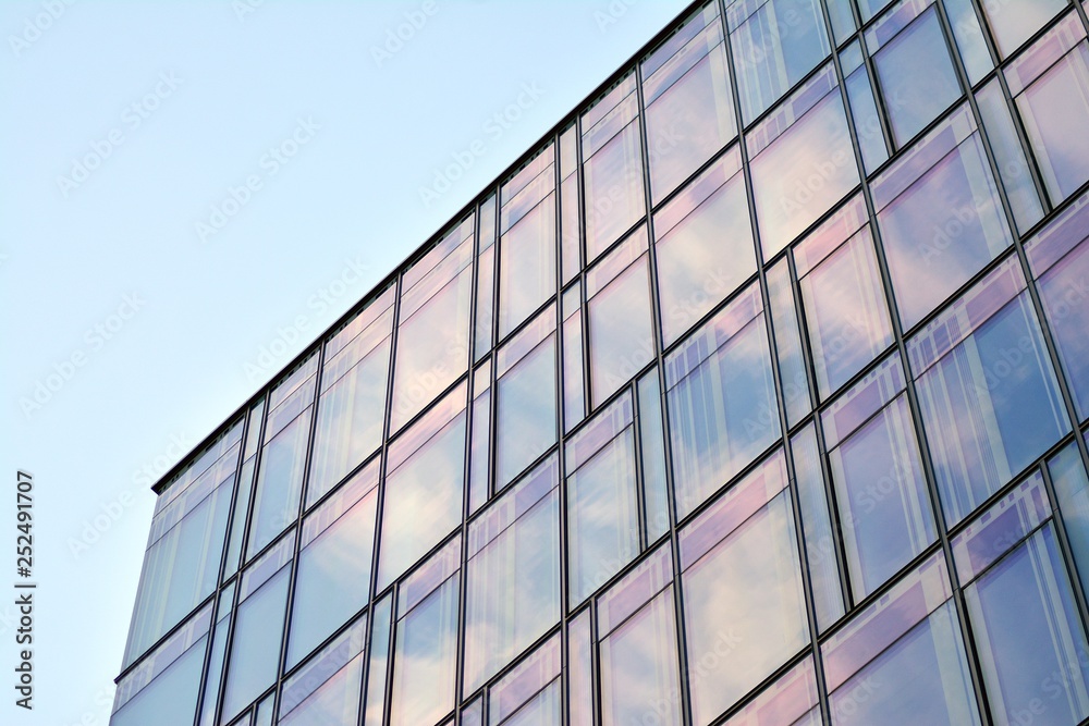 The windows of a modern building for offices. Business buildings architecture.