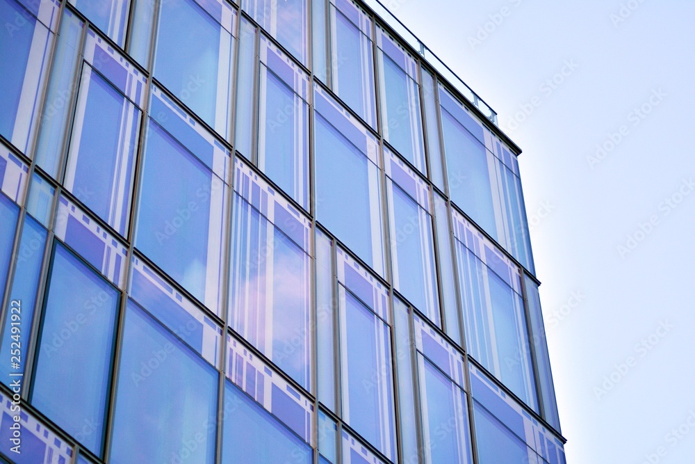 The windows of a modern building for offices. Business buildings architecture. The windows of a modern building for offices. Business buildings architecture.
